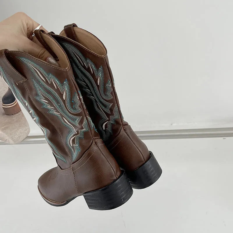Brown women's mid-calf Martin boots with embroidered detail, round toe, and low square heel.