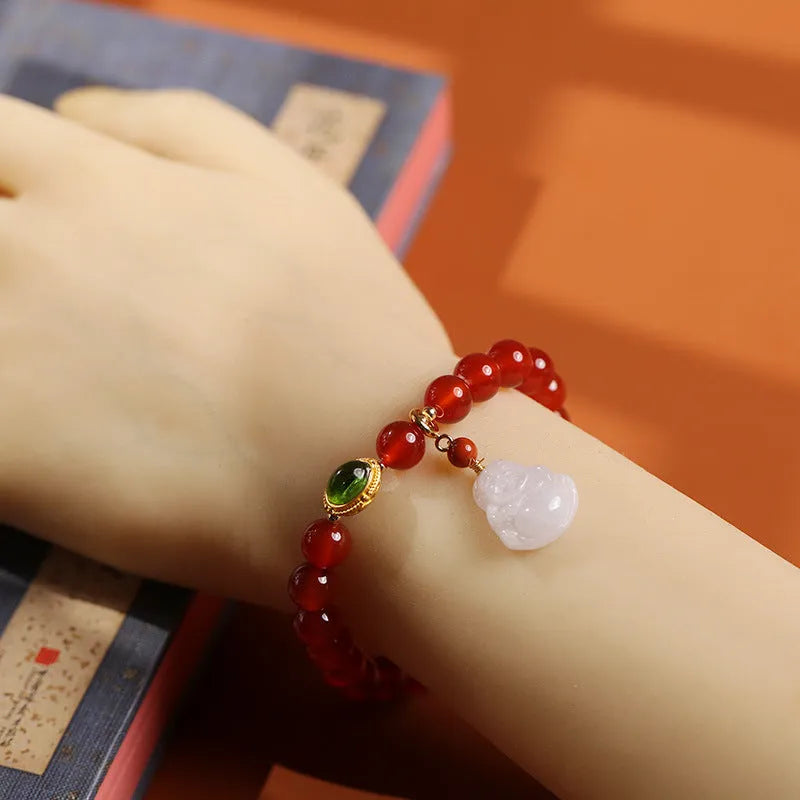 Women's handcrafted amber bracelet with red agate stones and gold Maitreya Buddha jade pendant