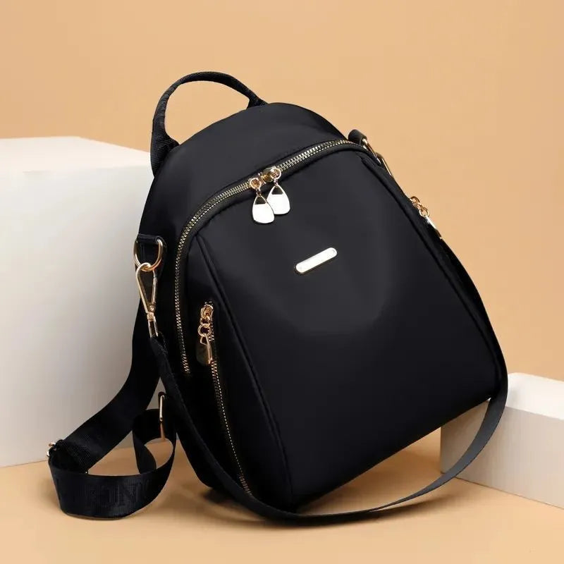 Women's Oxford cloth casual travel backpack in urban simplicity style with sewing line detail and sandwich pocket
