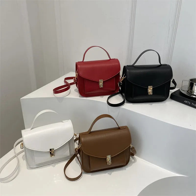 Retro style shoulder messenger bag in horizontal square shape with crossbody strap