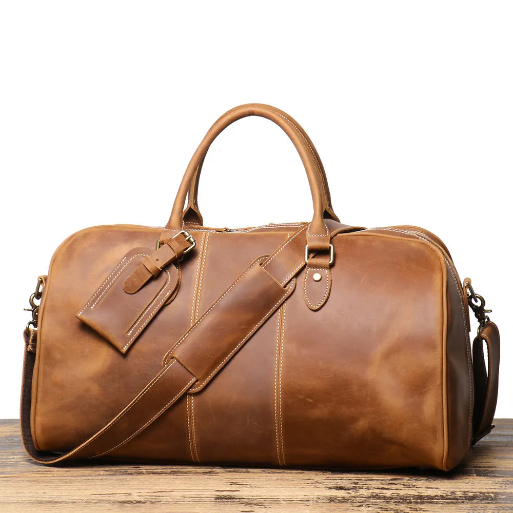 Retro genuine leather travel bag in vintage brown with sewing line detailing and shoulder strap