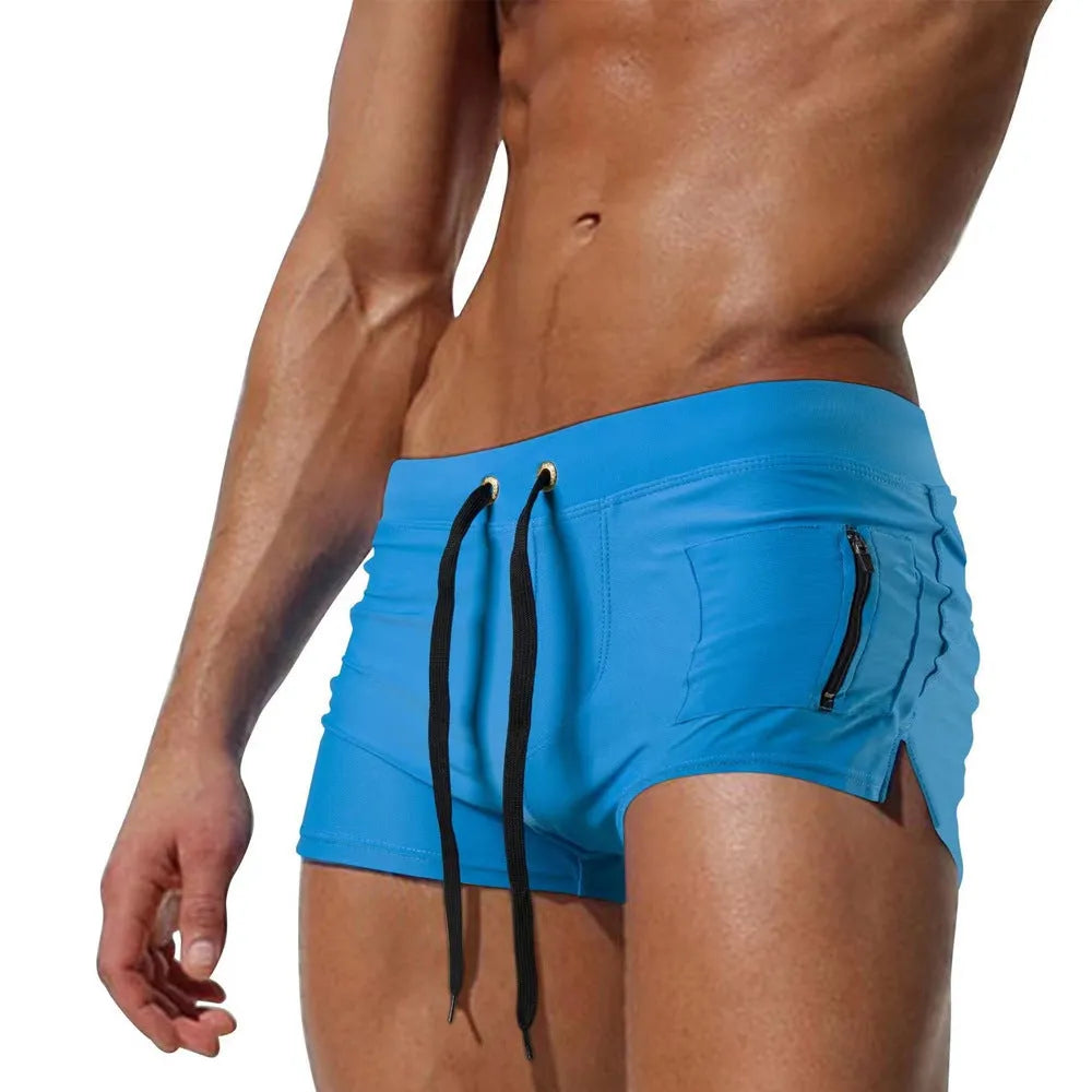 Men's black high-waist polyester swimming trunks with a lace-up front closure.