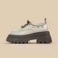 White women's platform Mary Jane shoes with a round toe, chunky high heel, and front lace-up detail.