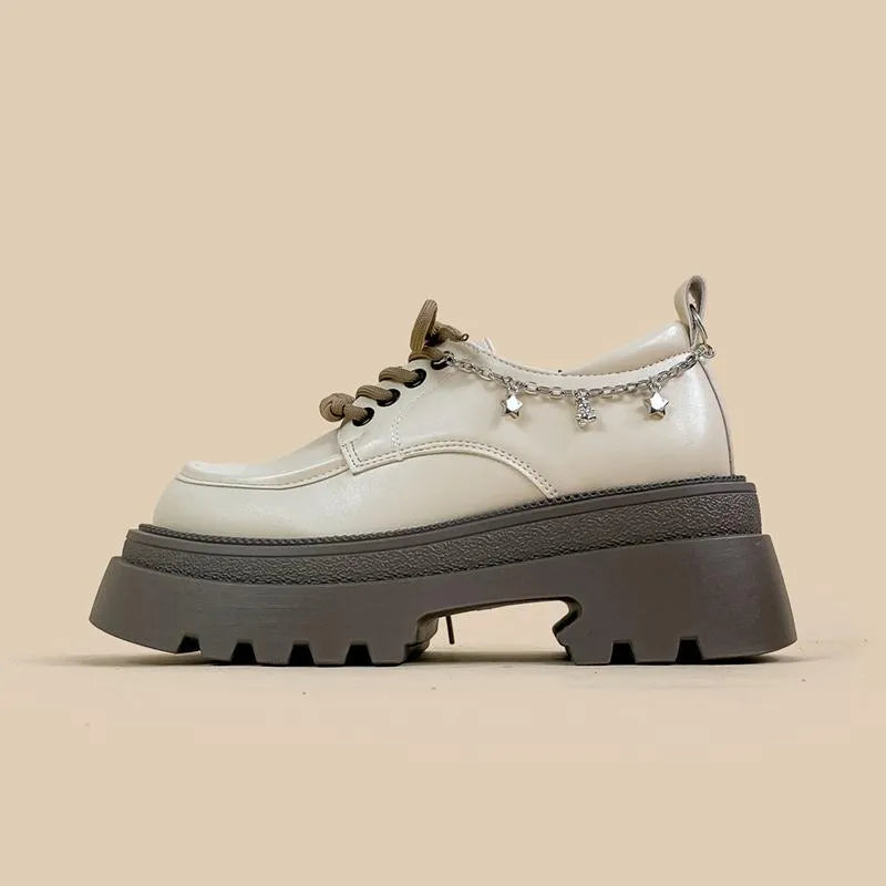 White women's platform Mary Jane shoes with a round toe, chunky high heel, and front lace-up detail.