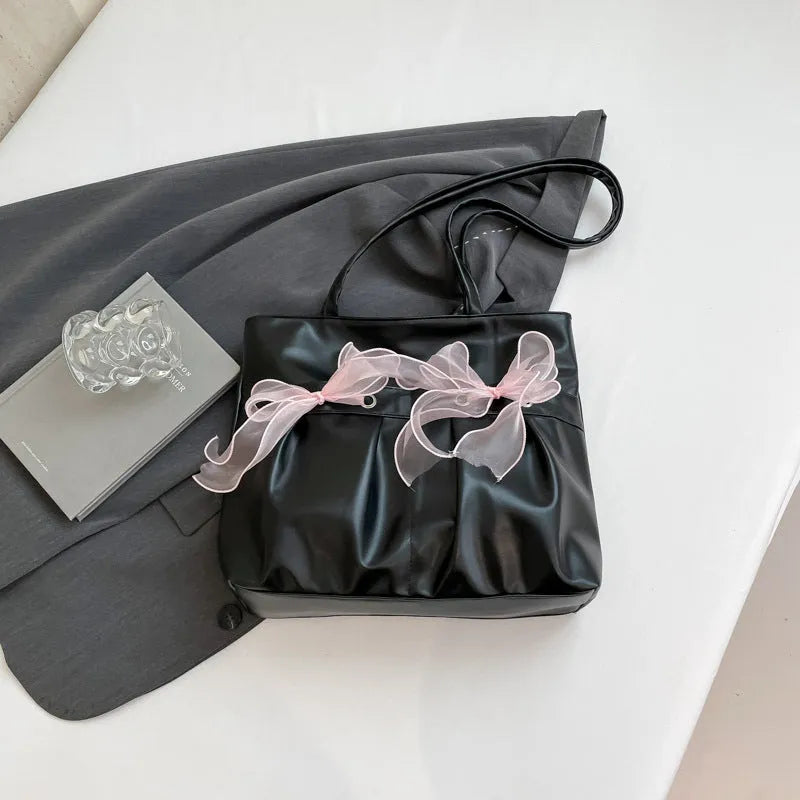 College style bow tote bag in black or pink with large capacity and internal zipper compartment