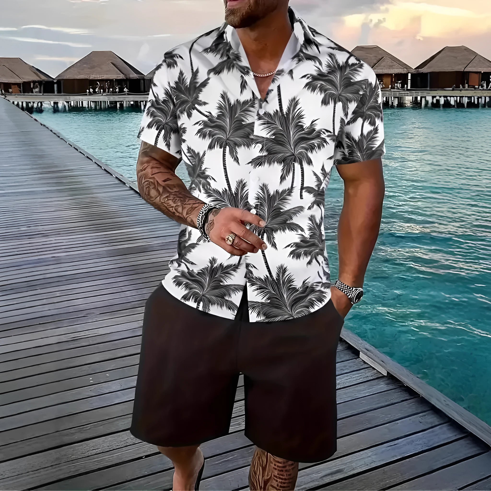 Man wearing a blue Hawaiian print short sleeve shirt and matching shorts from the casual suit set.