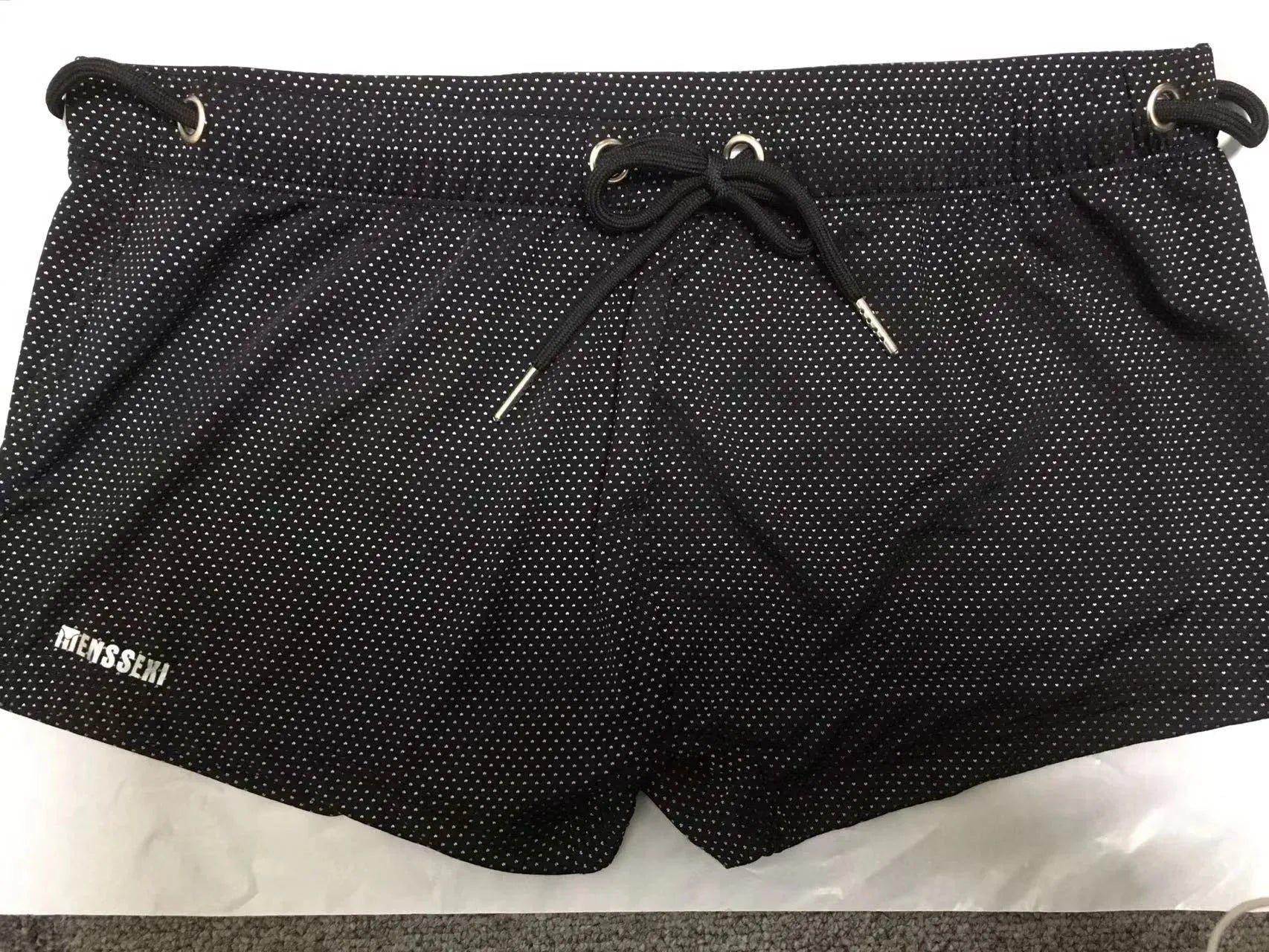 Men's low-waist boxer style swimming trunks with lace detailing in nylon fabric