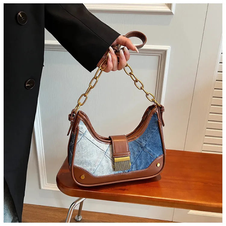 Women's brown denim shoulder bag with diamond chain accents and bucket shape design