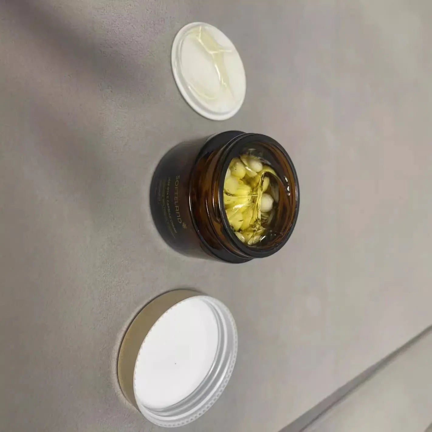 55g jar of portable vitamin C facial cream with spoon for daily skincare