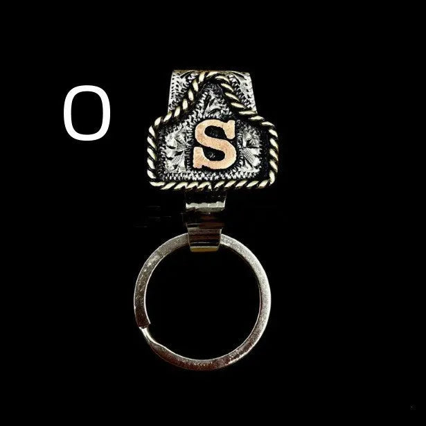 Handmade metal keychain with a cow tag charm in one of 26 available colour options.