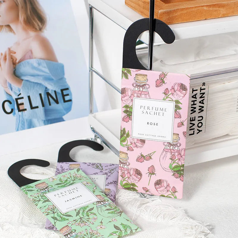 Five 30g lavender and rose scented wardrobe sachets on a shelf, each measuring 21x8cm