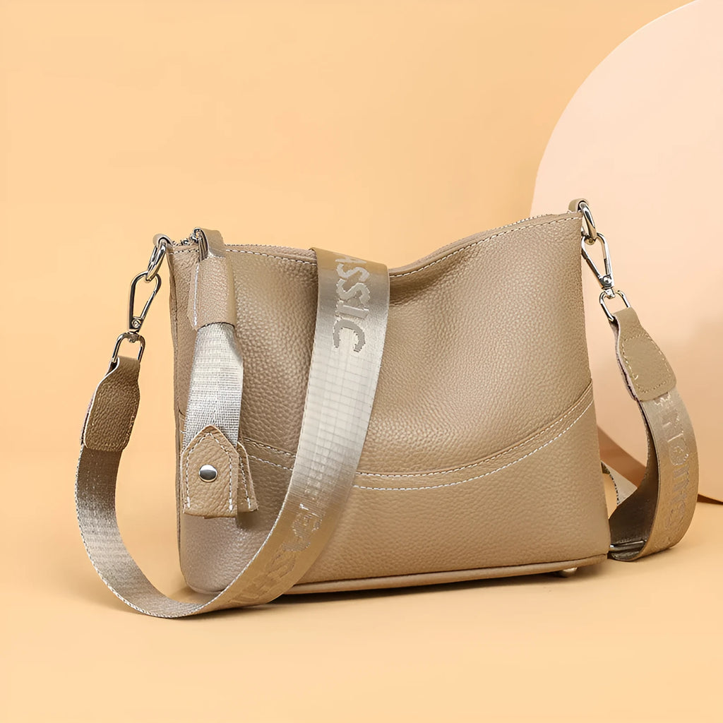 Genuine leather crossbody bag in black with spliced design and multiple internal pockets