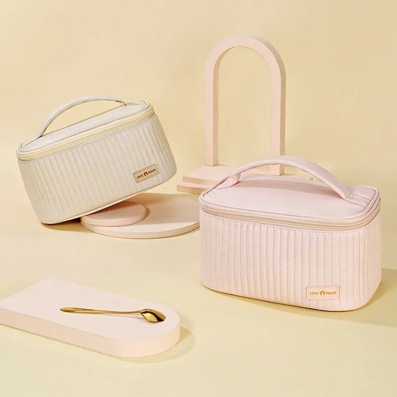 Open-top round cake-shaped makeup bag in a solid PU leather colour from the pink, coffee, beige, blue, green, purple range.