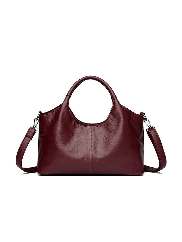 Genuine leather women's cross-body bag in multiple colours showing large capacity design