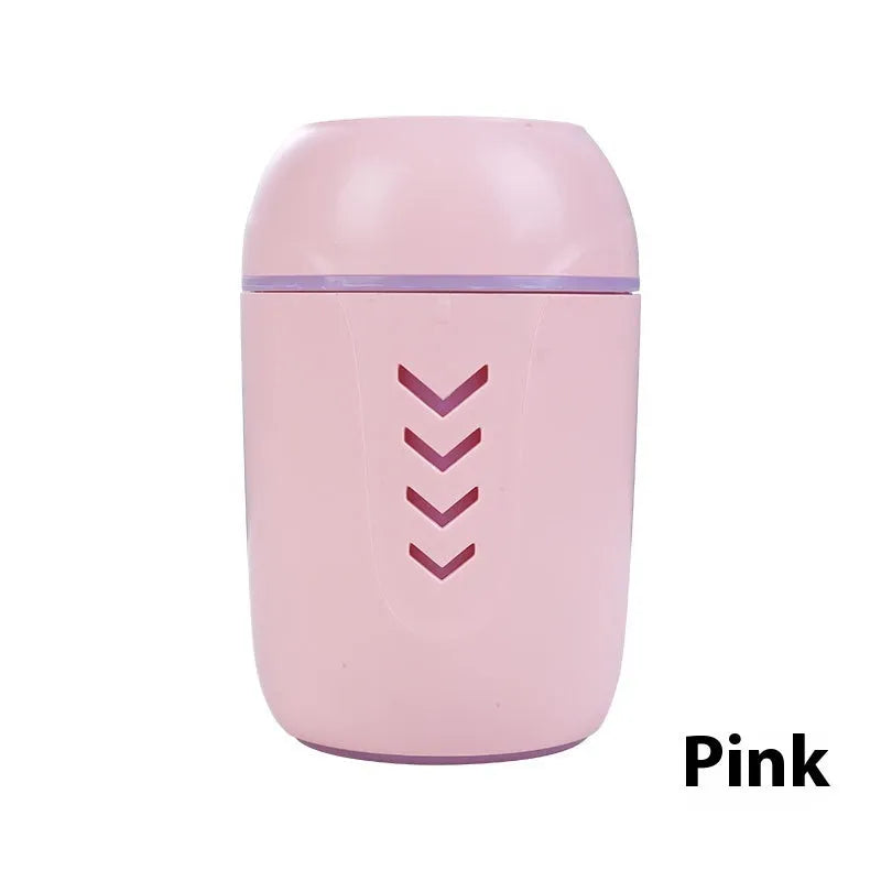 Compact round white portable air purifier with USB cable on a car dashboard and office desk.