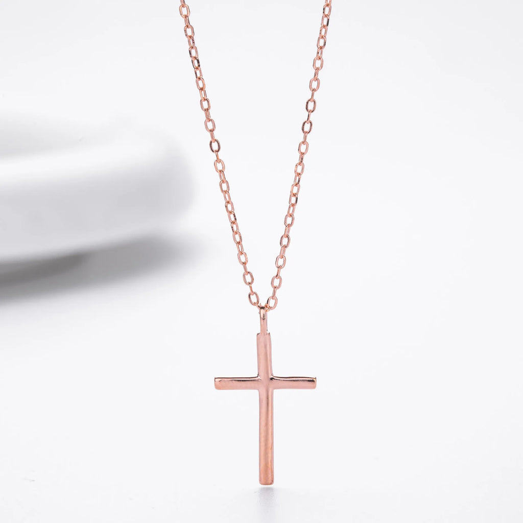 Simple sterling silver cross pendant necklace with glossy finish on adjustable O-link chain
