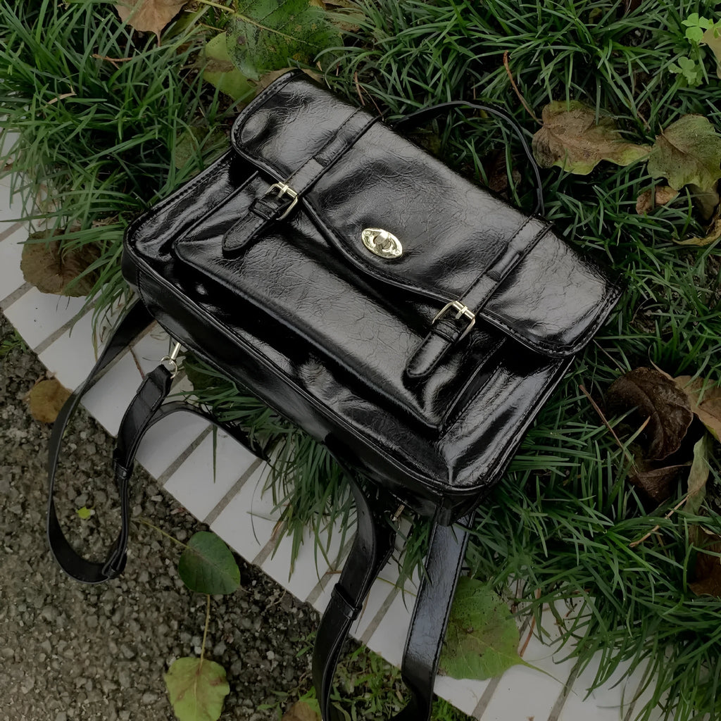 Black college style messenger bag made from oil wax PU leather showing 35cm length dimensions