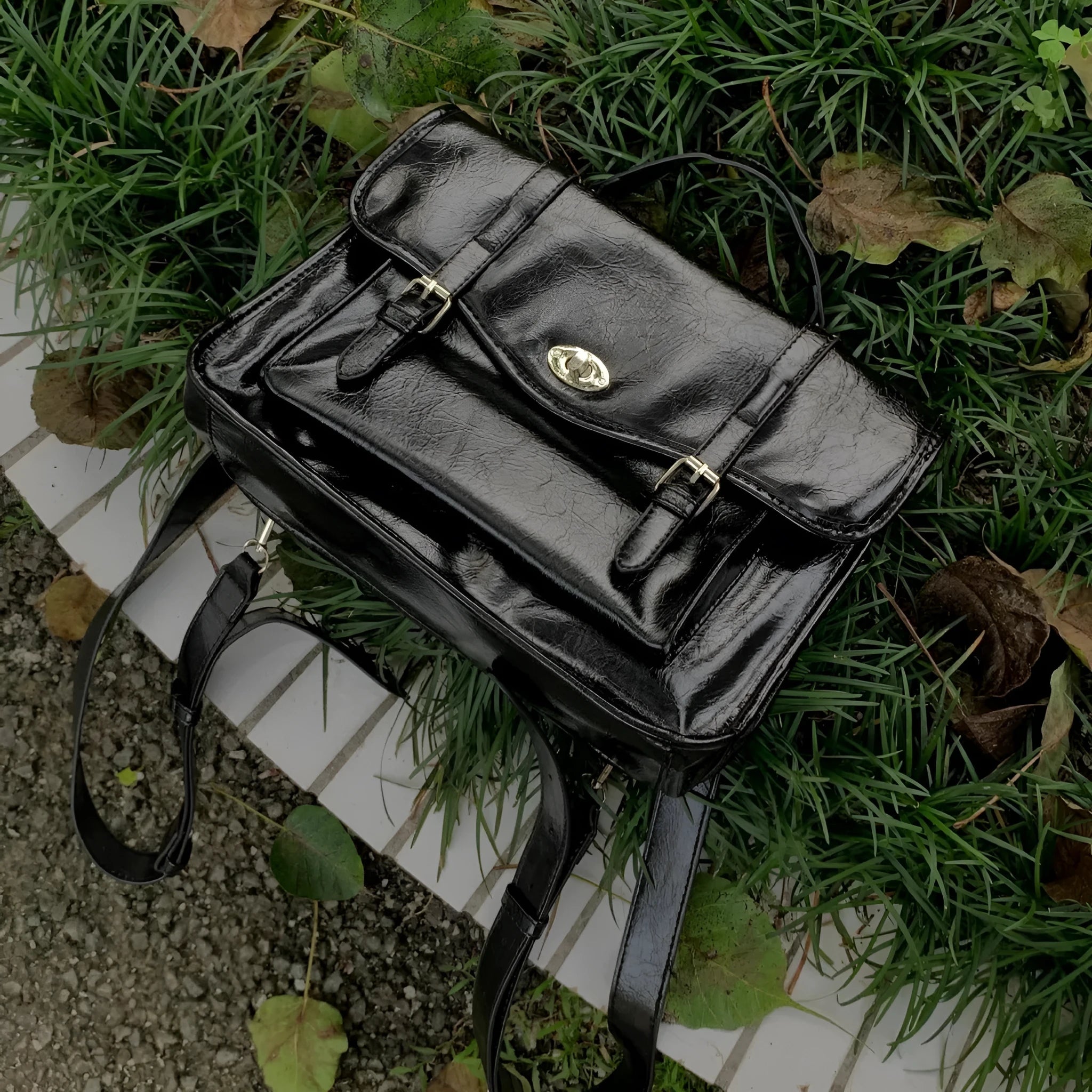 Black college style messenger bag made from oil wax PU leather showing 35cm length dimensions