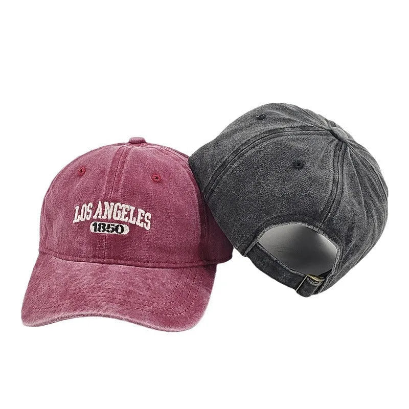 Retro-style personalised baseball cap with distressed letter embroidery on an adjustable strap, shown in beige colour.