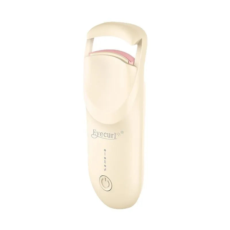 Electric heating eyelash curler in plastic housing with USB cable on a vanity