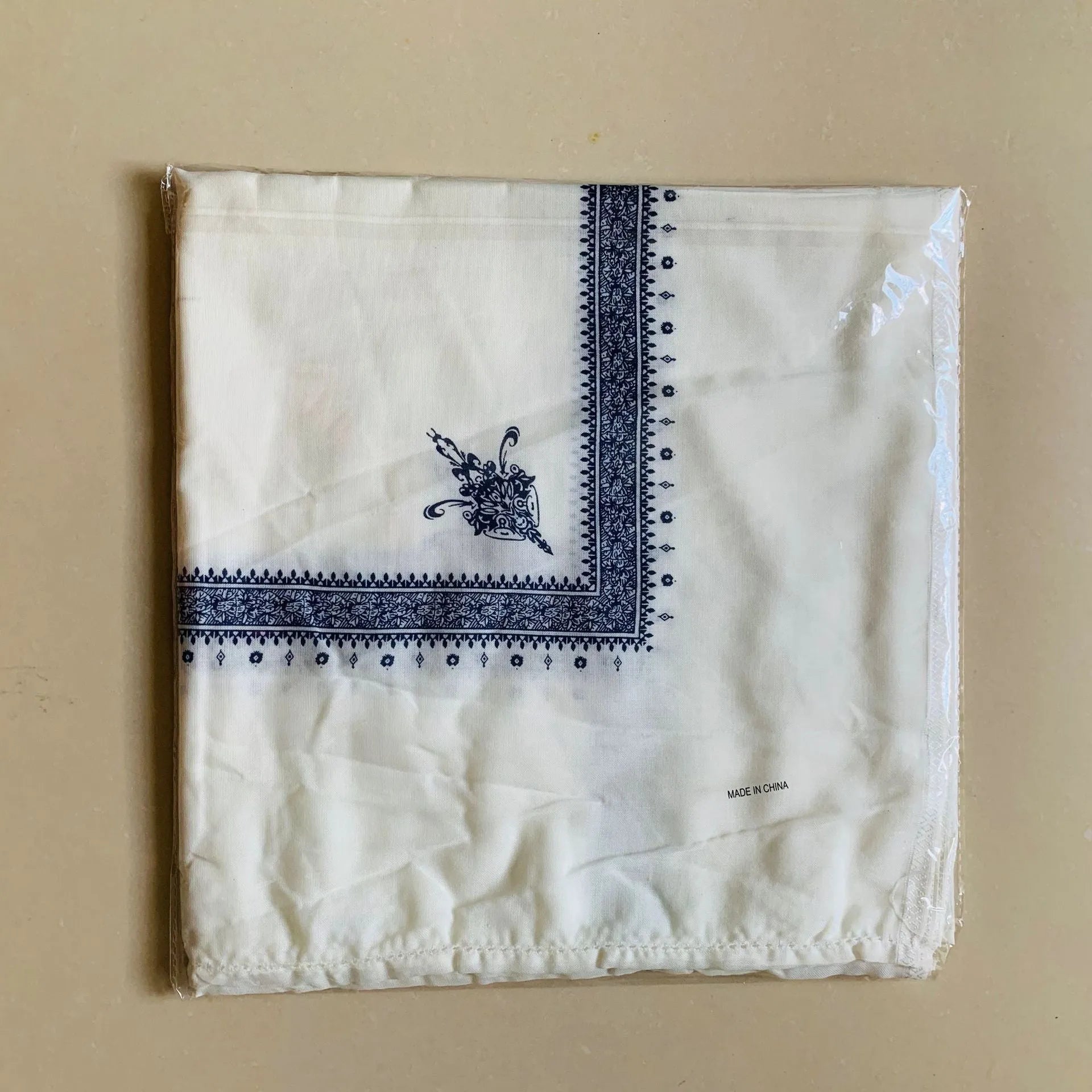 Printed square polyester scarf showing 138cm dimensions and colour options including navy blue and purple