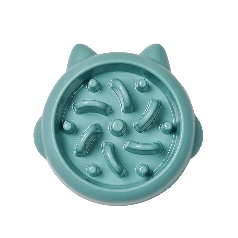 Green pet slow feeder bowl with raised bone-shaped obstacles inside to slow down eating.