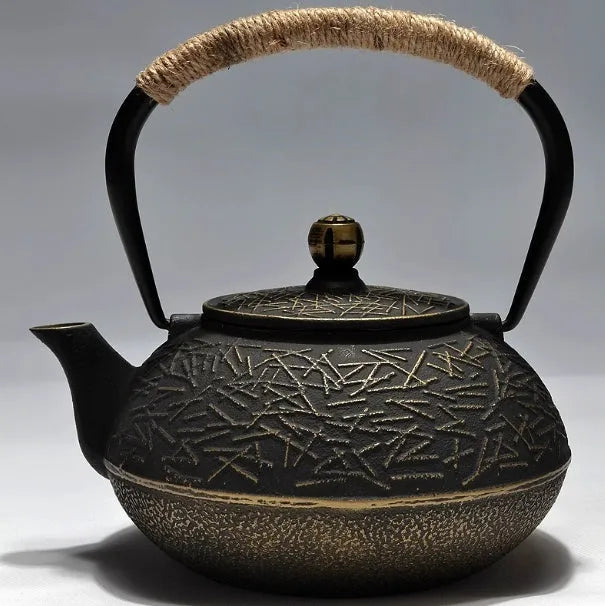 Japanese-style cast iron teapot with traditional decorative patterns and 0.9 litre capacity