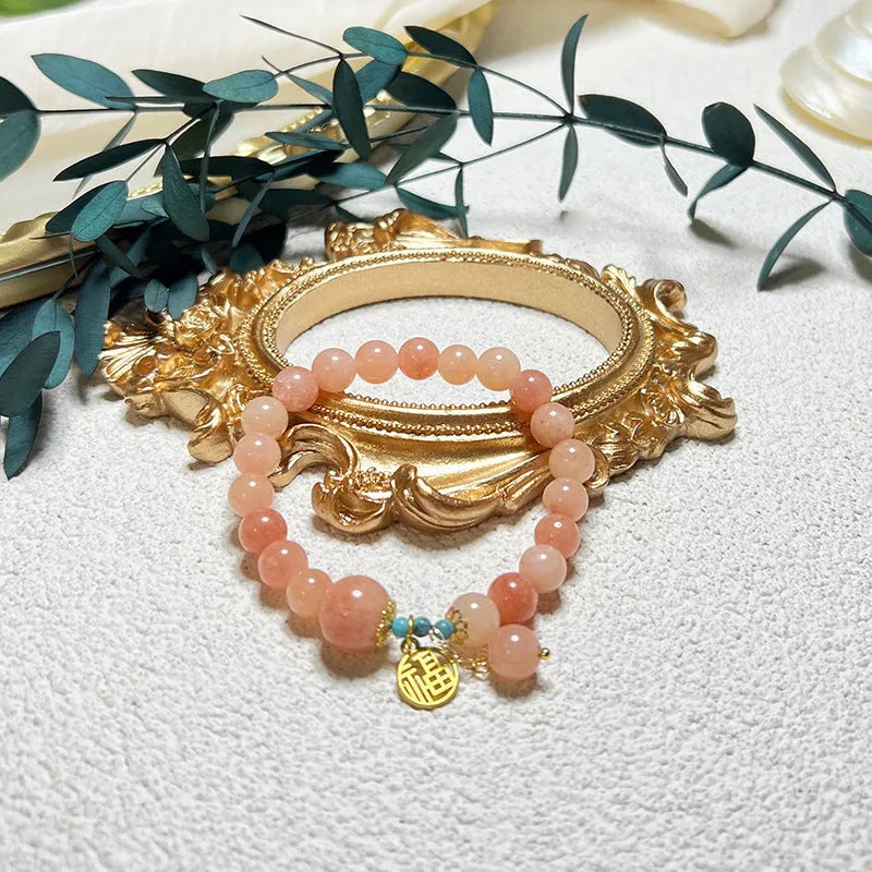 Fashion pink natural stone bracelet for women with alloy setting simple style on white background