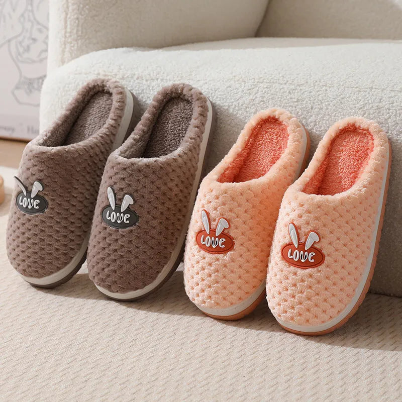 Rabbit plaid pattern women's house slippers with artificial fur upper and rubber sole.