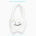 White plush shoulder tote bag with large tooth pattern decoration and zipper closure
