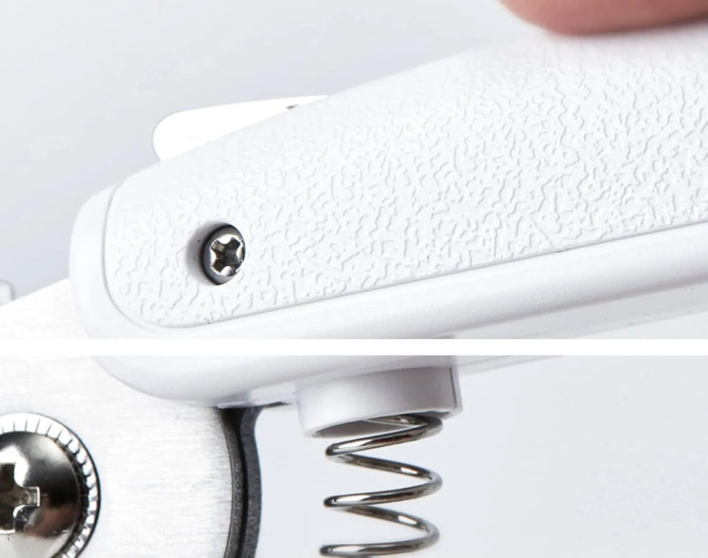 White pet nail clippers with LED light and a transparent anti-splash guard, shown with a nail file.