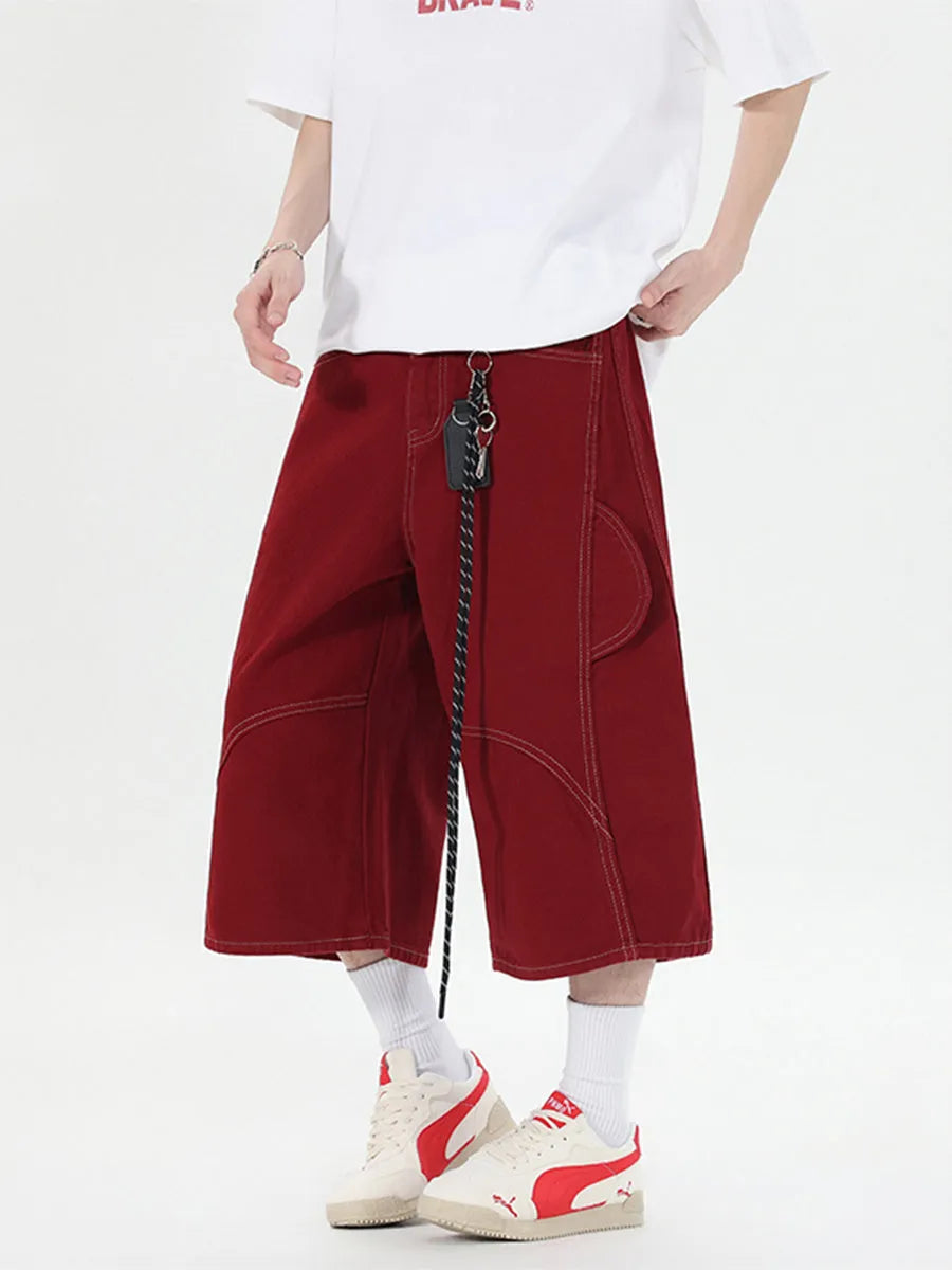 Black and red wide leg denim cropped pants with multiple pockets and mid waist
