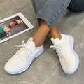 Women's Flyknit running shoes in Creamy White with mesh lining and rubber sole