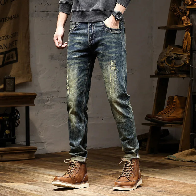 Men's skinny-fit jeans in a retro blue colour with a zip fly, shown laid flat.