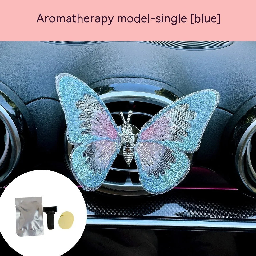 Moving embroidery butterfly decoration on car centre console air vent in pink fabric