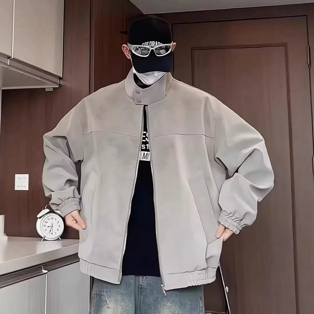 Men's grey tie-dye PU leather jacket with a stand collar and side pockets in a loose fit.