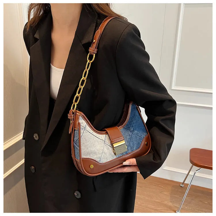 Women's brown denim shoulder bag with diamond chain accents and bucket shape design