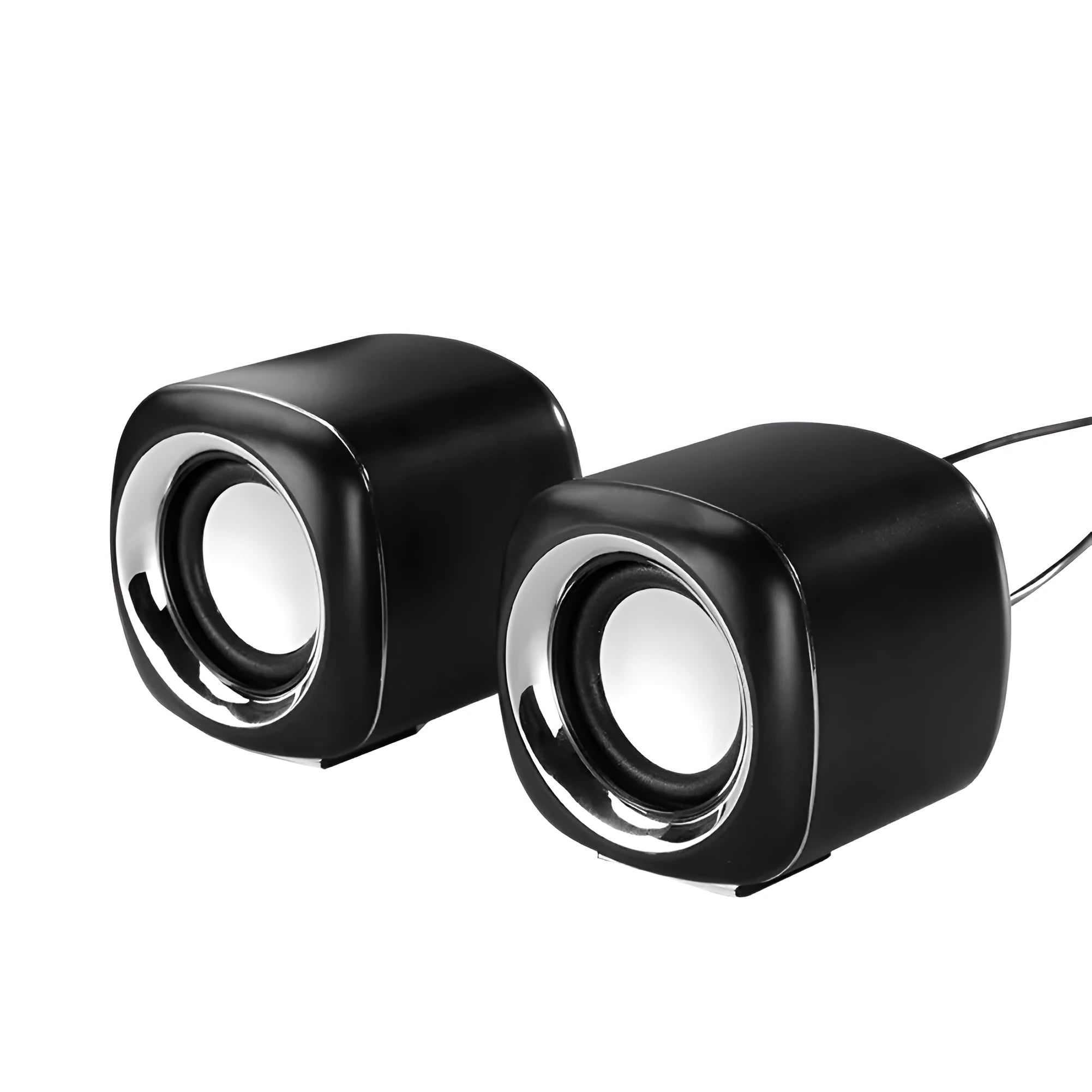 A pair of compact black wired desktop computer speakers with a volume scroll wheel, shown next to a 3.5mm audio plug.