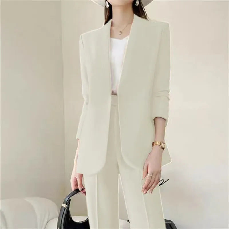 Women's polyester business suit set with blazer and trousers in beige, model standing