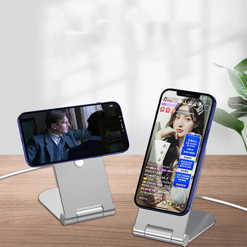 Silver aluminium alloy magnetic phone bracket for iPhone 12 showing adjustable vertical positioning