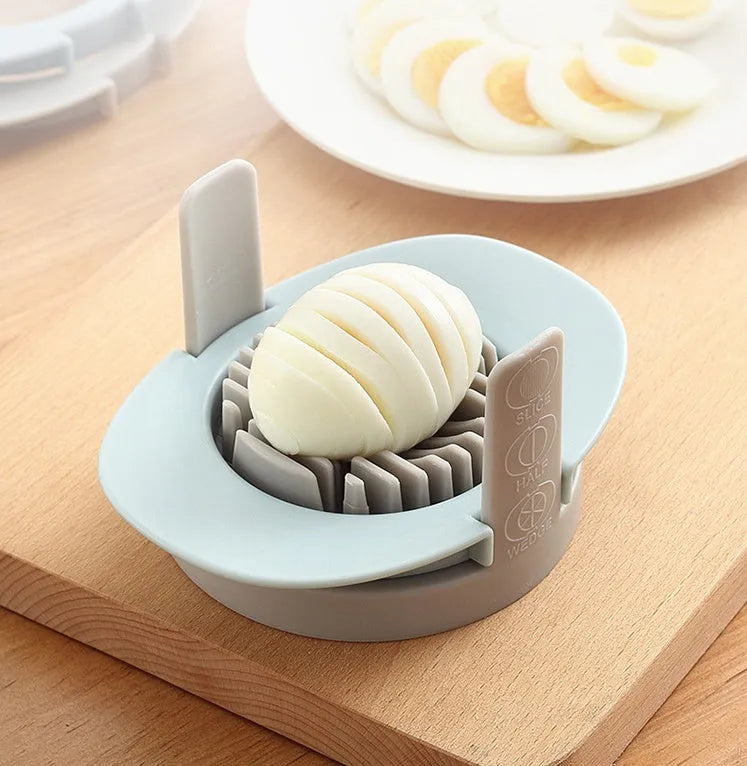 Manual egg cutter three-in-one with stackable parts, PS body, SS304 blades, available in blue, orange, red