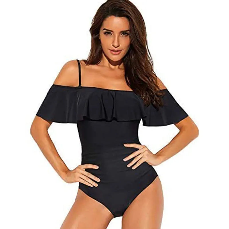 Black one-piece swimsuit with cut-out side detailing and ruffled straps