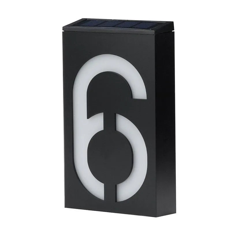 Solar powered outdoor house number light with LED illumination and concealed mounting design