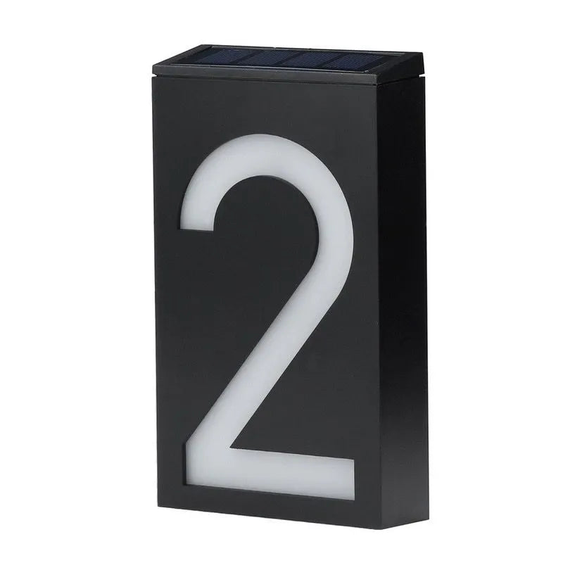 Solar powered outdoor house number light with LED illumination and concealed mounting design