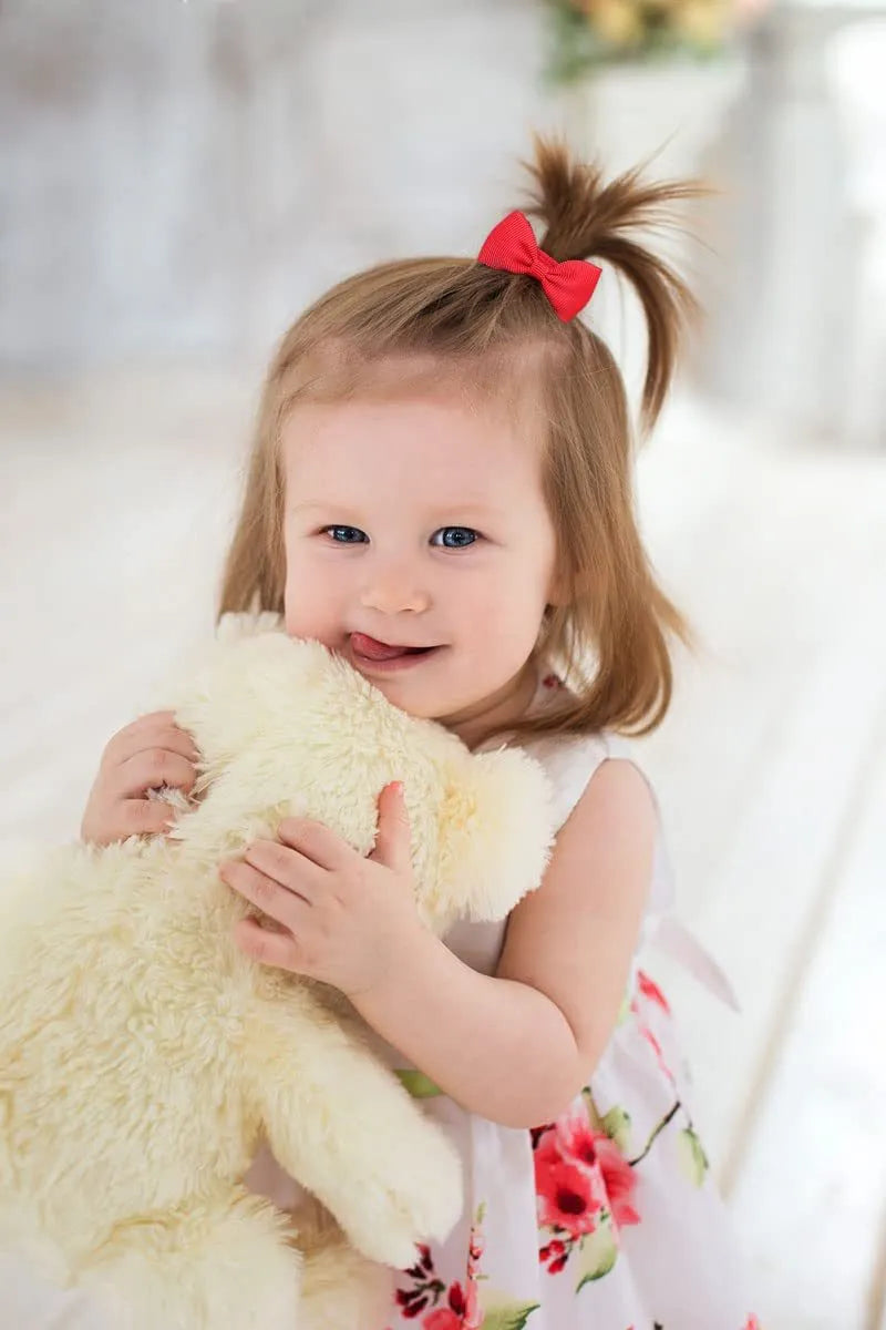 80 multi-coloured baby hair ties with small grosgrain ribbon bows for infants and toddlers.