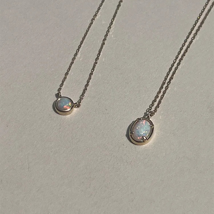 Geometric oval jelly opal pendant necklace in S925 silver with gold or white gold plating.