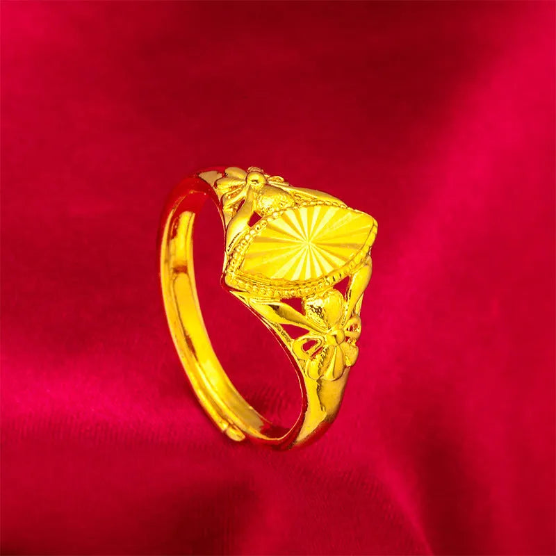 Gold geometric flower ring with open diamond design and textured surface on brass base