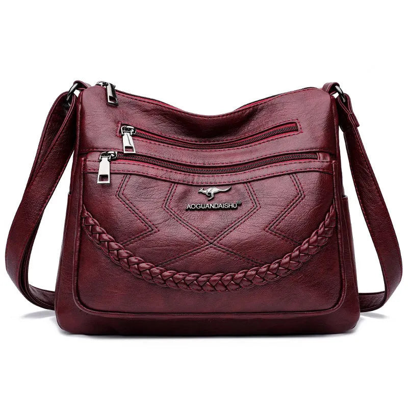 Women's black PU leather crossbody shoulder bag with large capacity and zipper compartment
