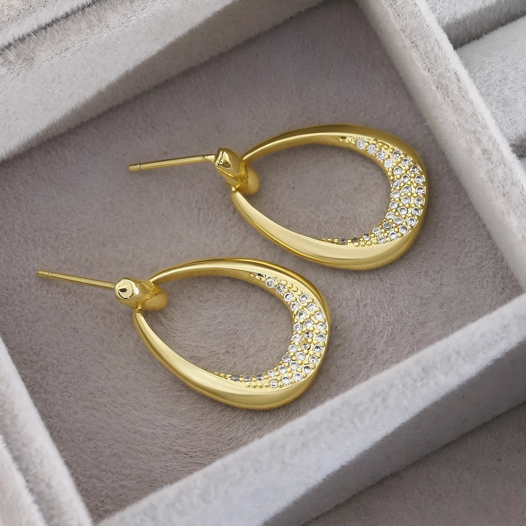 Yellow gold geometric drop earrings with zircon detailing on copper base, measuring 2.6cm