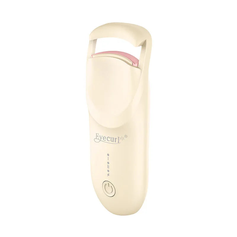 Electric heating eyelash curler in plastic housing with USB cable on a vanity